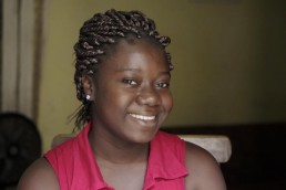 Josiane smiles as she explains how Mobile Money allows her to make quick, secure transactions in Ivory Coast