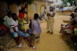 Elyse uses Mobile Money on her phone in her remote village in Ivory Coast