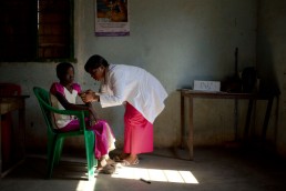 A health worker with GAVI vaccinates a boy against measles and rubella in Tanzania