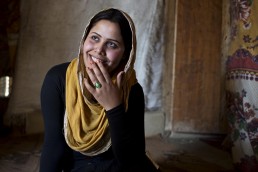 A Syrian refugee poses for a portrait in Lebanon