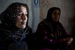A Syrian refugee poses for a portrait in Lebanon
