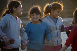 Young Syrian refugee girls play in the evening light in Lebanon
