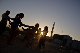 Syrian refugee girls play at sunset in Lebanon