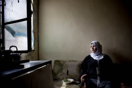 A Syrian refugee poses for a portrait in Lebanon